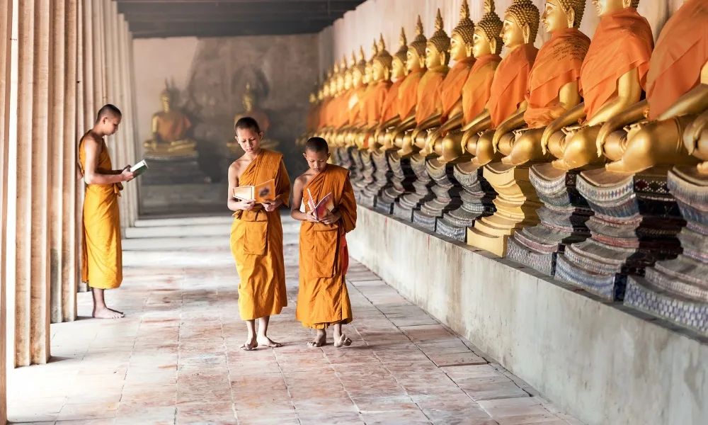 Buddhist monks walking barefoot in the temple